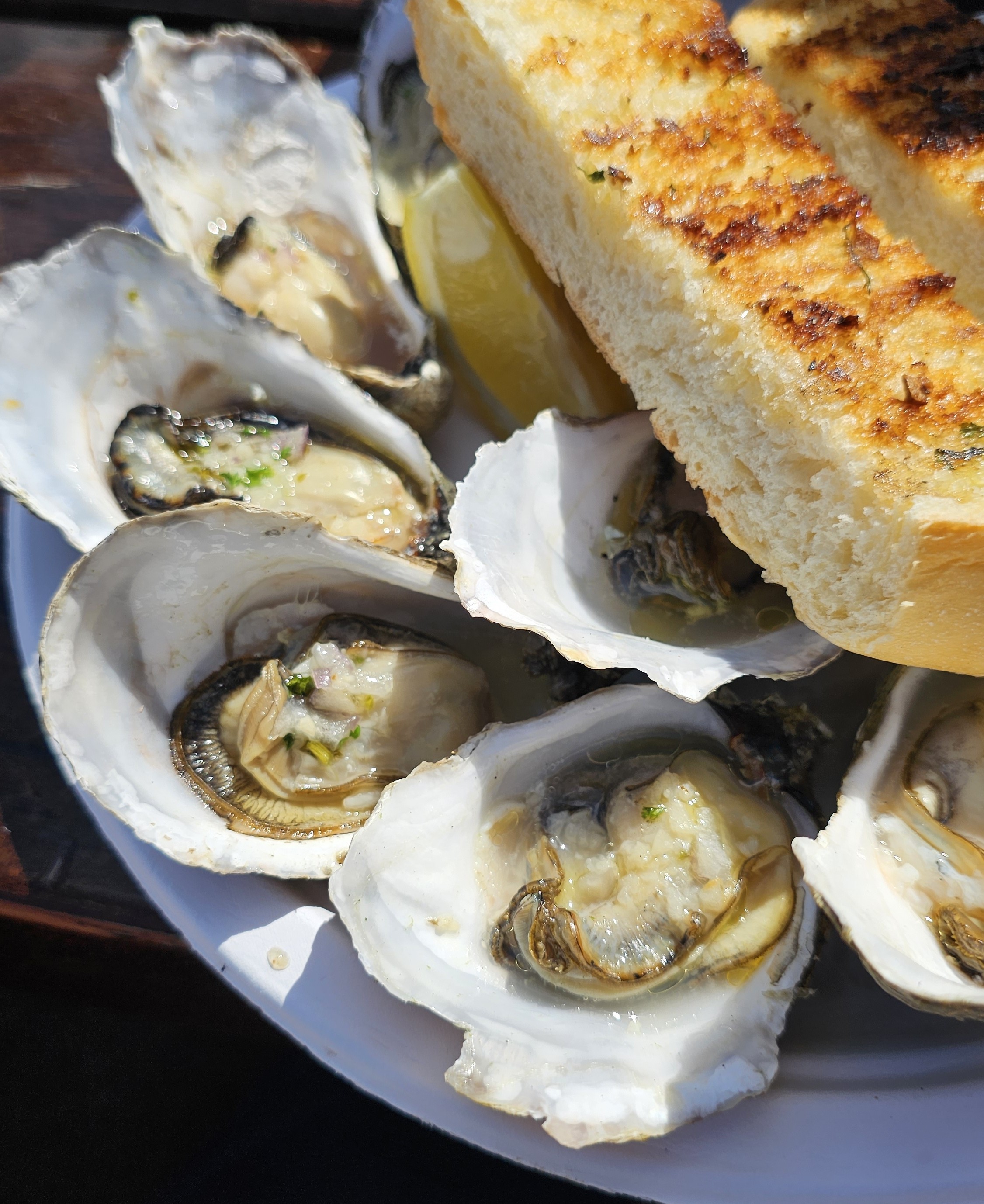 Raw oysters with grilled bread and lemon