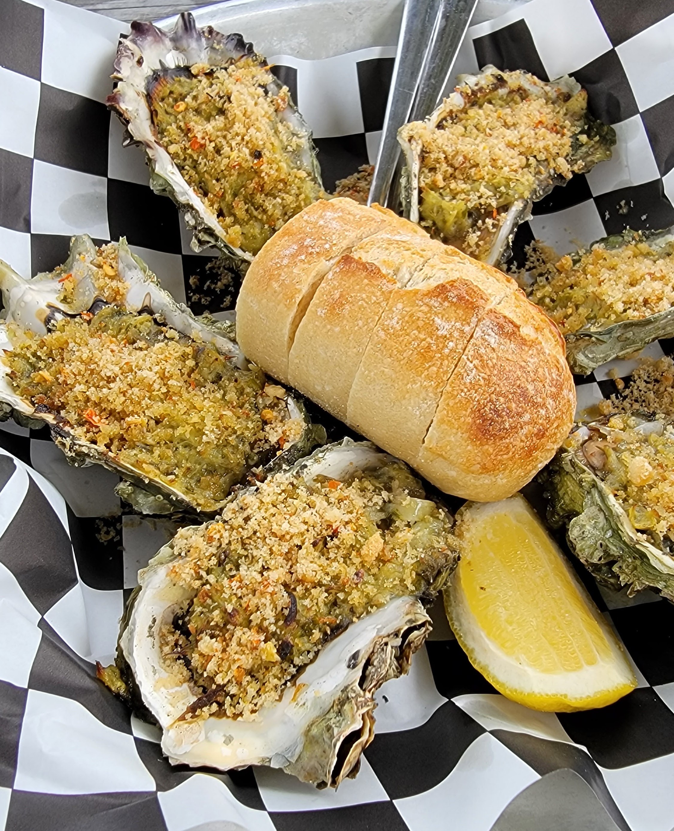 Baked oysters with bread and lemon